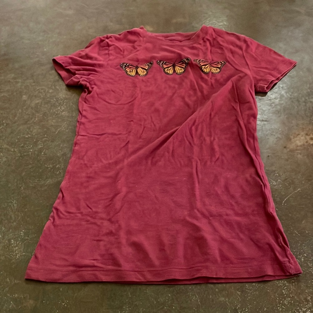Red shirt with orange butterfly’s